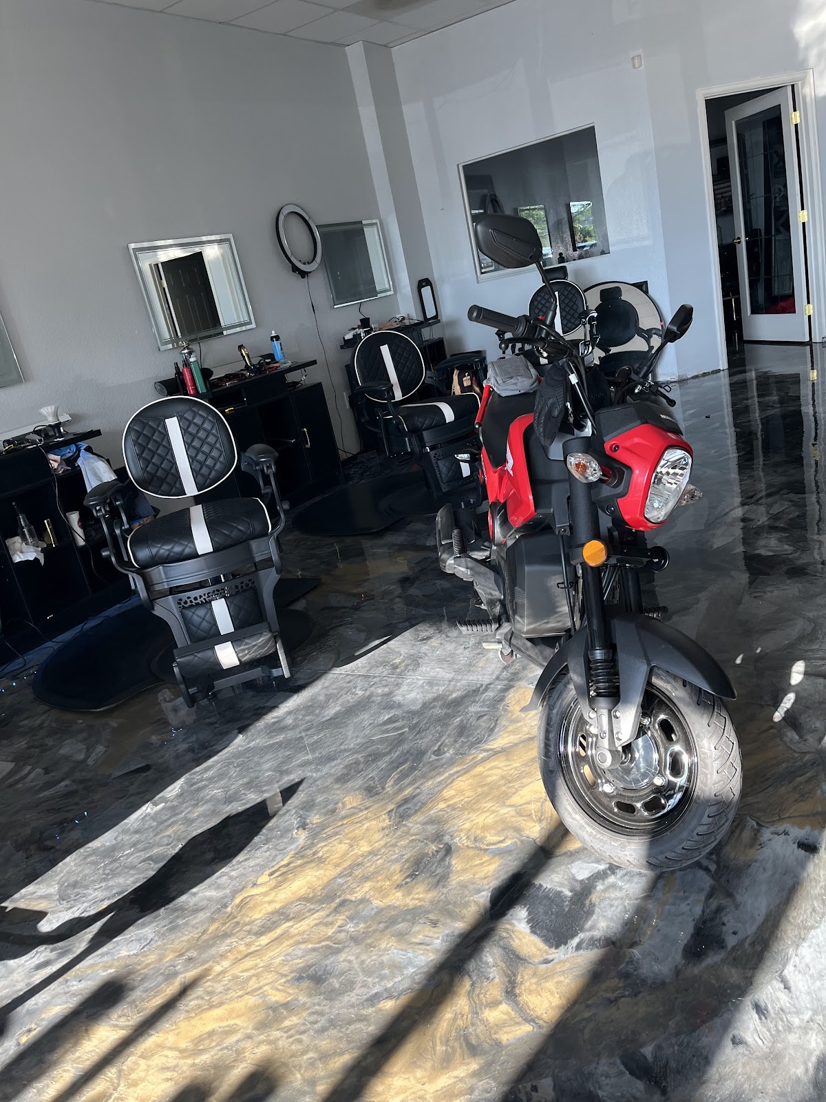 Inside the shop — barber chairs and stations